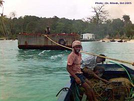 The pantoon  towed by small boat